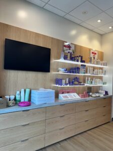 Interior of a beauty and waxing salon with retail products on display